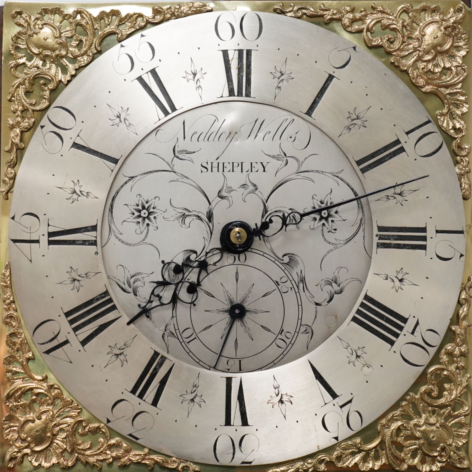 Neddy Wells of Shepley-18th century oak cased 30 hour longcase clock c 1760, with a swan necked pediment and two gesso ball and spire finials, square trunk door flanked by plain turned pilasters with gesso capitals, trunk with recessed quarter columns and a long trunk door, square plinth raised on bracket feet, with a brass dial, cast spandrels, silvered and engraved dial centre with makers name and calendar dial, chapter with Roman numerals, five minute Arabic's and matching steel hands, rope driven countwheel movement striking the hours on a bell. With weight and pendulum. 
Neddy Wells is recorded as working at Shepley near Huddersfield c1720-80.
