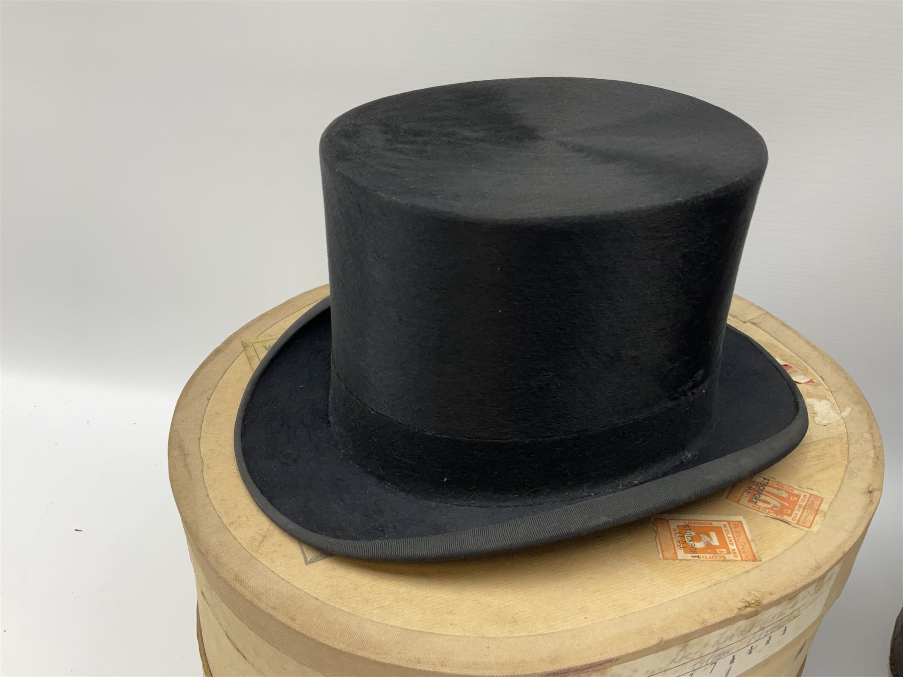 Top hat by Tress & Co London, in a  fitted leather leather case,  Top hat by Chapellerie Francaise. 