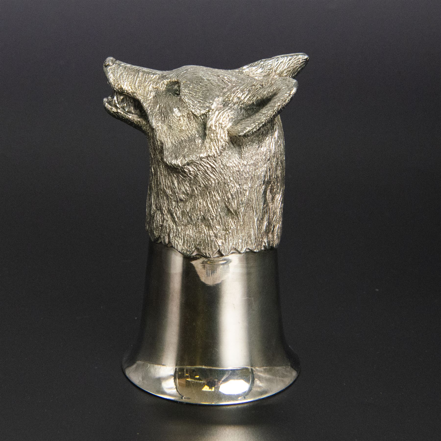 Late 20th century silver stirrup cup, modelled as a fox head to a cup of plain fluted form, hallmarked Royal Irish Silver Co, Sheffield 1971, H11.5cm