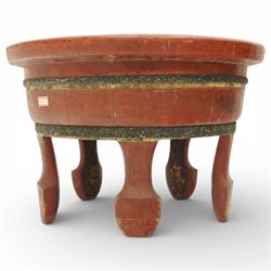 Chinese red painted wooden wash bowl, of circular form with a thickened rim above a tapering body with painted bands, raised on five short supports