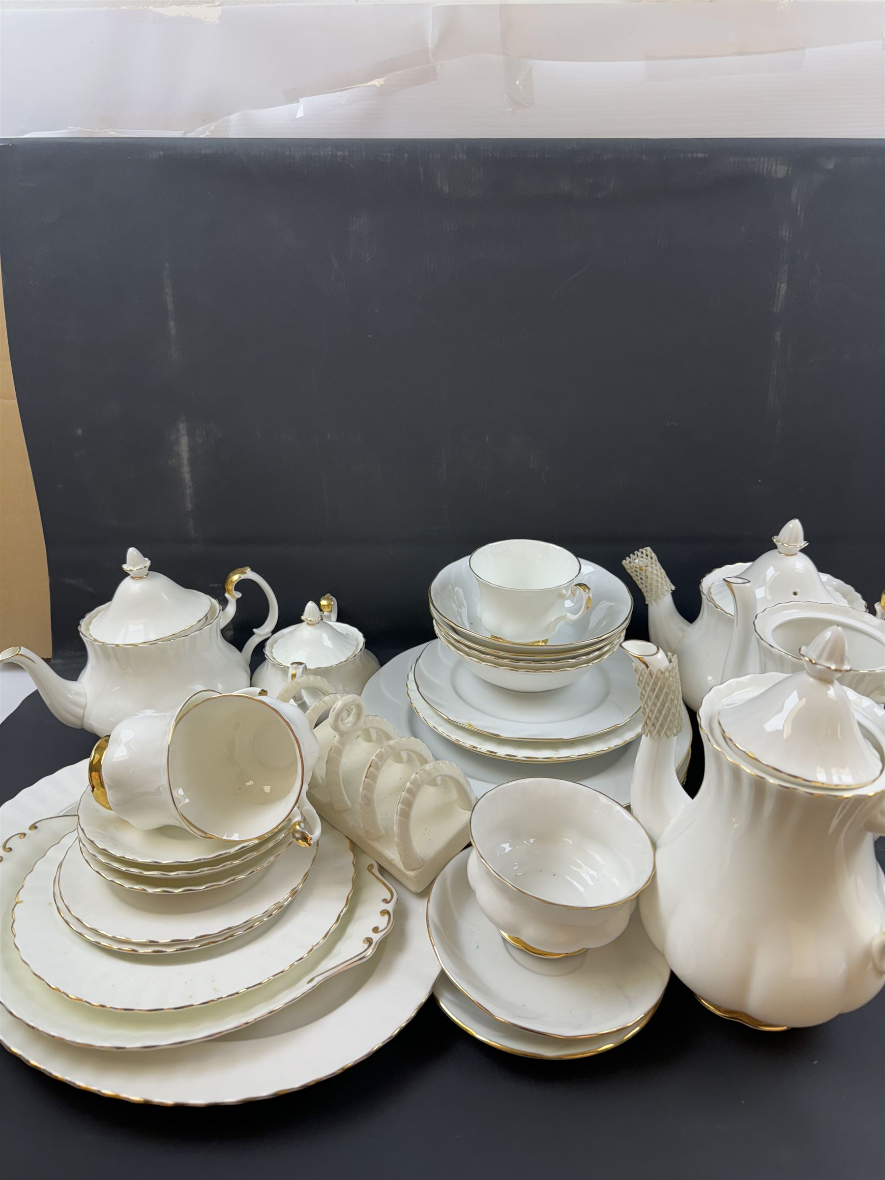 Royal Albert Val D'or part tea and dinner service, including two coffee pots, two teapots, milk jug, covered sucrier etc together with matching items 