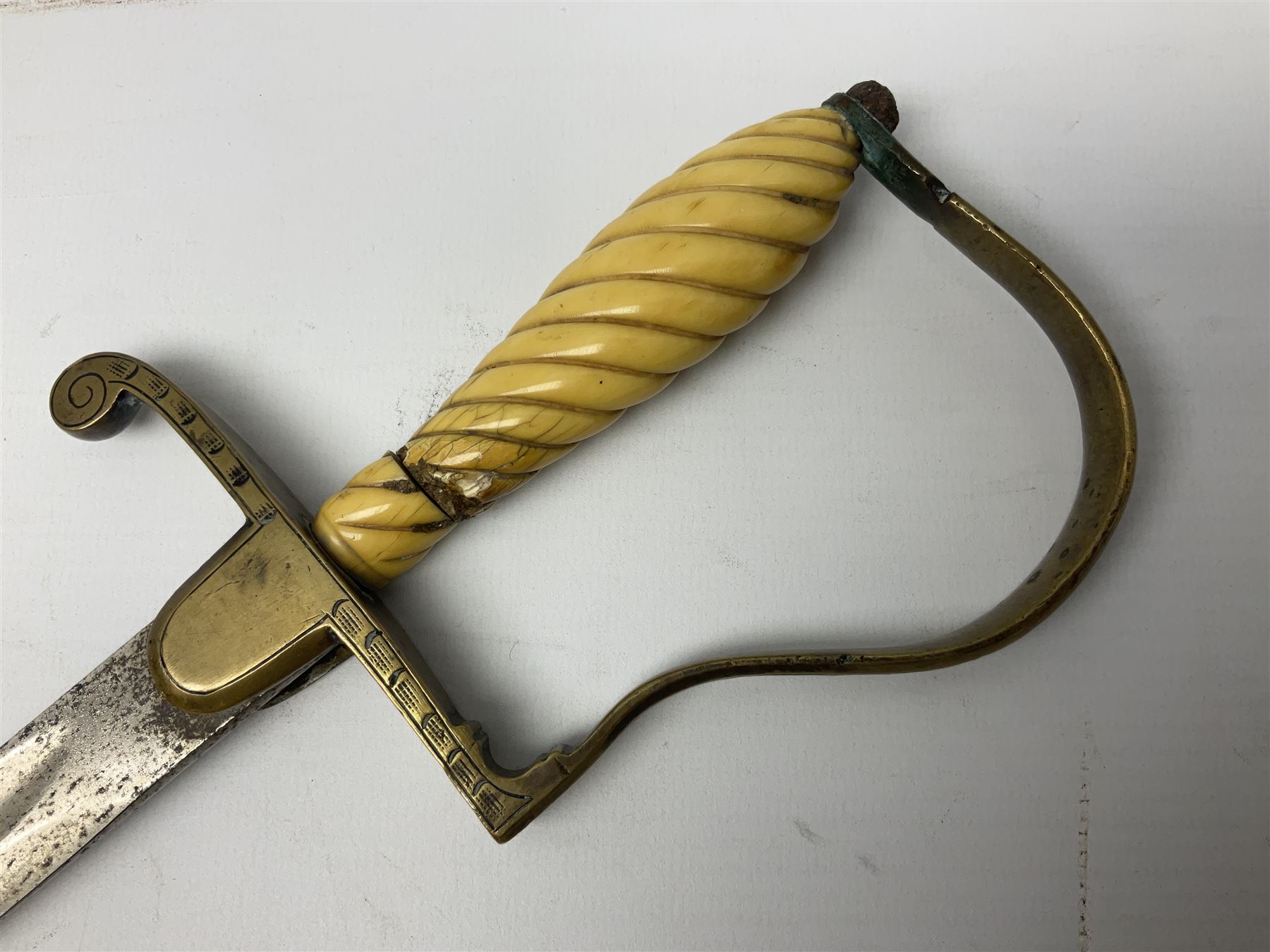 1900-1918 German Imperial NCO sabre with WW2 modifications of Wehrmacht insignia to the langet, 79cm slightly curving fullered blade and brass hilt, the knucklebow chased with oak leaves and acorns L90.5cm overall
This item has been registered for sale under Section 10 of the APHA Ivory Act 