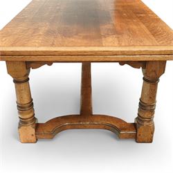 17th century design oak refectory extending dining table, the rectangular planked top with cleated ends, with two concealed leaves, raised on turned baluster supports united by shaped stretchers (Extends to 331cm)