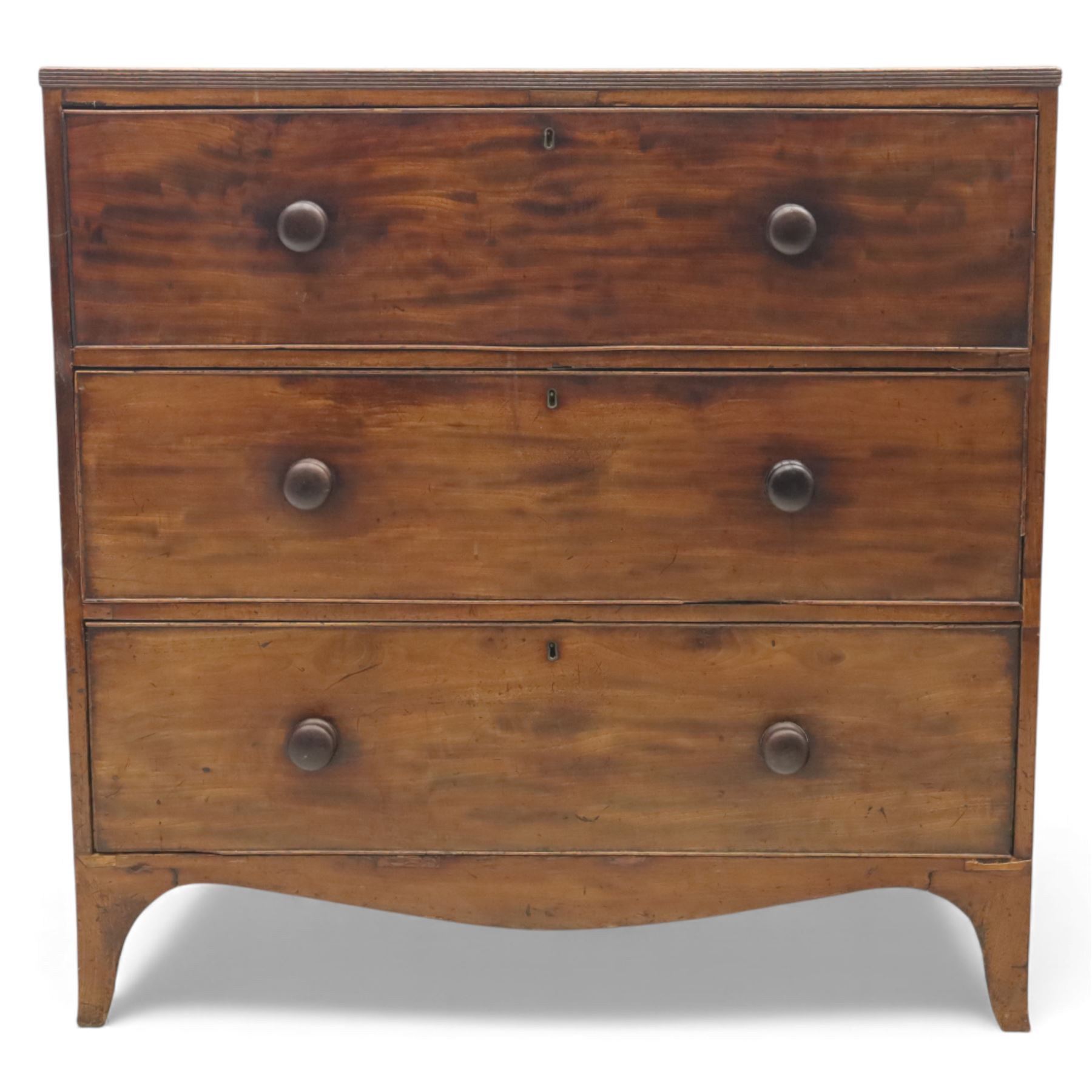 Early 19th century mahogany secretaire chest, the rectangular top over a fall-front fitted with pigeonholes and small drawers, above two long drawers with turned wooden knobs, upon swept bracket feet