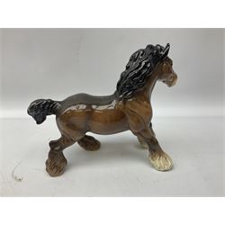 Five Beswick figures, comprising grey Shire horse no. 818, bay cantering Shire no.975, bay Burnham Beauty no. 2309 and two bay Shire horses no. 818, all with printed mark beneath 