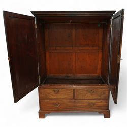 George III mahogany linen press, dentil moulded cornice over a pair of panelled doors enclosing a later fitted interior, lower section with two short over one long cockbeaded drawer, brass swan neck handles, shaped bracket feet