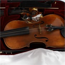 Two 19th century violins, each with two piece maple backs, ebonised wooden pegs and finger boards and modern plastic chin rests, with two bows, all contained within a modern two-violin soft case with red interior