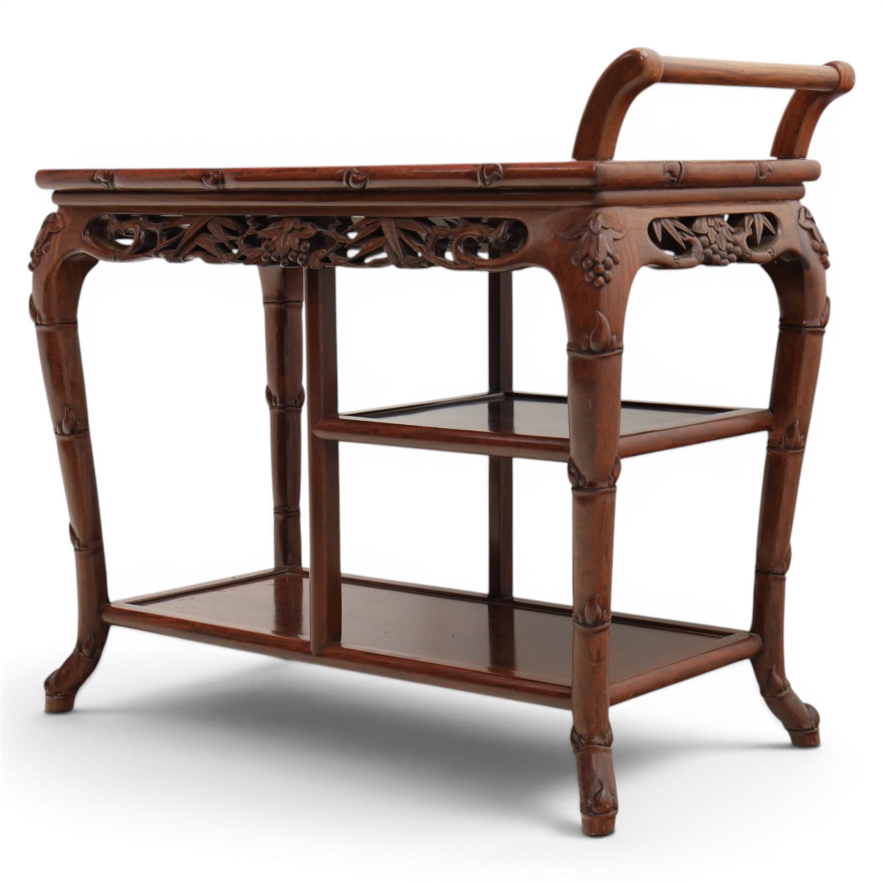 20th century Chinese ornately hardwood tea trolley, rectangular top with handle, pierced frieze above a half shelf above a full length undertier, raised on shaped supports