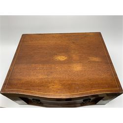 Late 19th/early 20th century composite canteen of silver flatware, contained within an early 20th century mahogany serpentine fronted case with twin drop carry handles, and hinged cover with boxwood stringing and central inlaid shell motif, above a single drawer with twin ring handles and Wellington style locking system, the cover and drawer opening to reveal plaque for Spink & Sons Ltd London, and fitted interior containing ivory handled knives, ivory handled carving set, and silver Hanoverian and Old English pattern cutlery, each with engraved monogram to terminal, hallmarked London, makers Spink & Son (John Marshall Spink), Goldsmiths & Silversmiths Co, and Chawner & Co (George William Adams), various dates ranging 1880-1923, gross weighable silver 92.59 ozt (2880 grams)