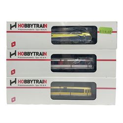 Hobbytrain 'N' gauge - three locomotives - H2970 Vectron Ep.VI CargoServ; H14902 Strassenbahn Duwag M6 Muhlheim/Ruhr; and H14903 Strassenbahn Duwag M6 Nurnberg; all boxed (3)