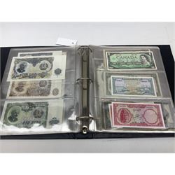 World banknotes, including Queen Elizabeth II The States of Jersey one pound 'DB202703', five pounds 'BB527762' and ten pounds 'AB651481', reserve bank of New Zealand two dollars '1L3 741894', King George V Straits Settlements one dollar 1st January 1935 'F/83 28924', various Bank of England notes etc, housed in two ring binder albums