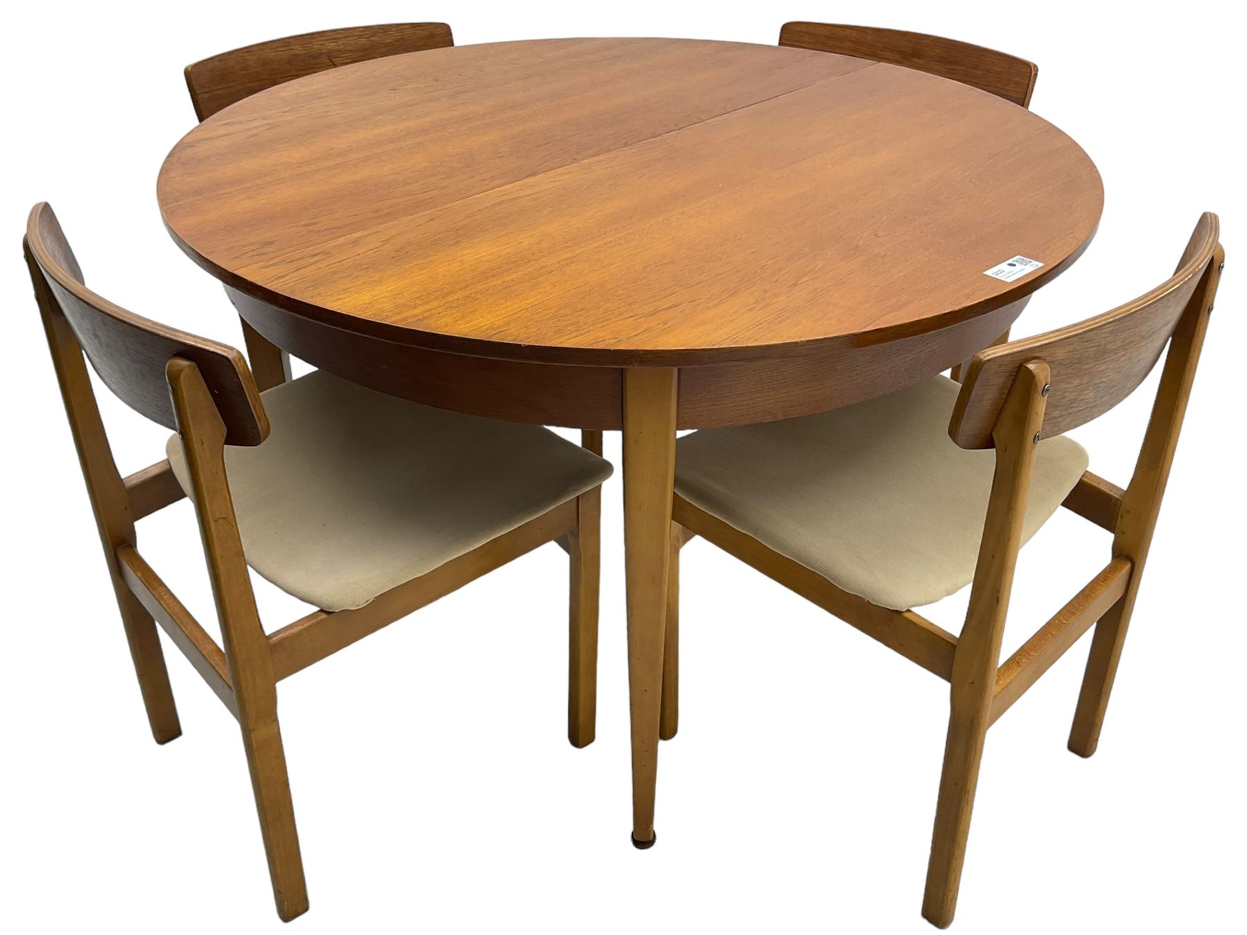 G-Plan - mid-20th century teak extending circular dining table, with concealed additional leaf (W114cm, H72cm); and a set of four mid-20th century teak dining chairs, seat upholstered in beige fabric