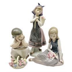Three Lladro figures, comprising Pondering, no 5173, Nostalgia, no 5071 and Nature's Bounty, no 1417, all with original boxes, largest example H27cm