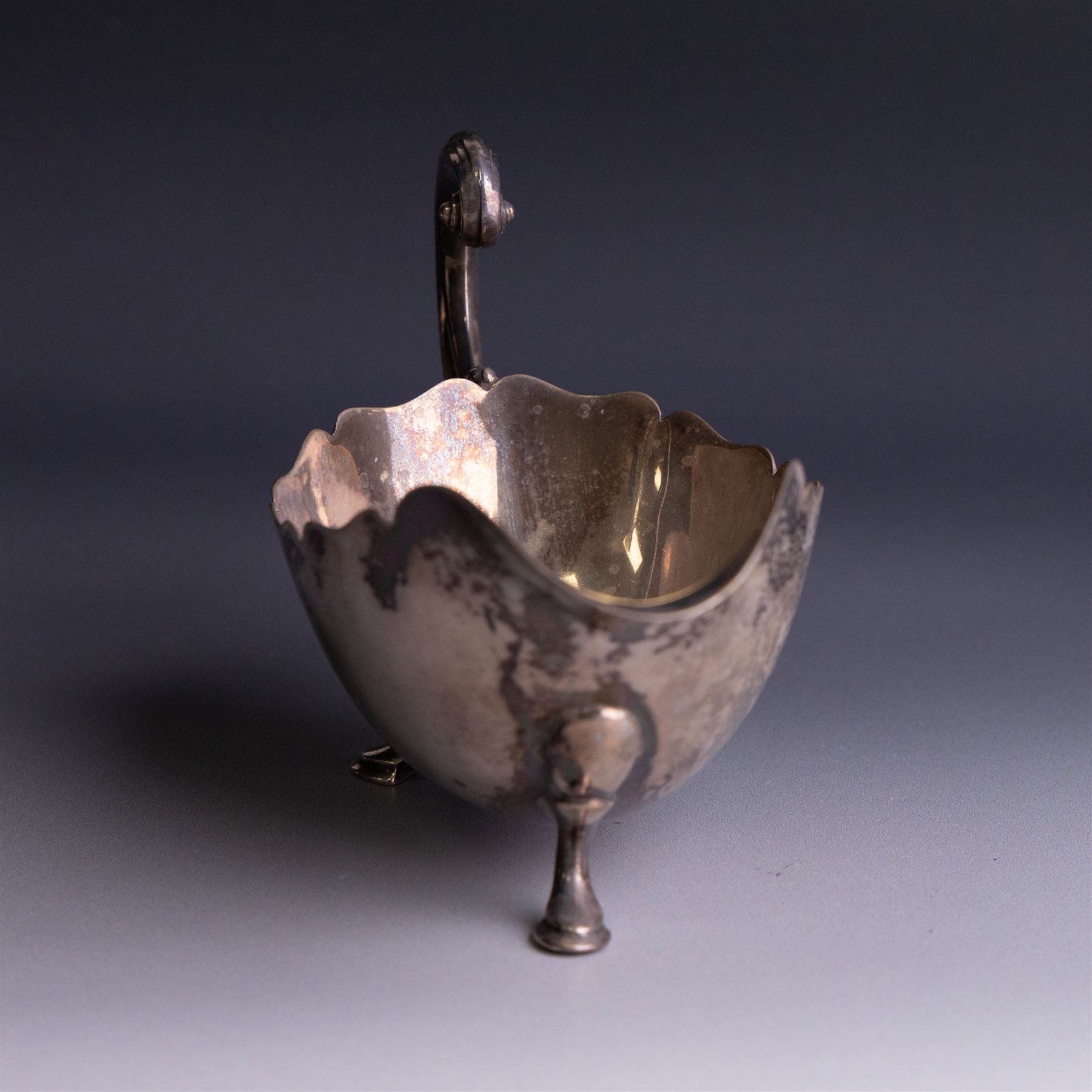 1930s silver sauceboat, of typical form with shaped rim and flying C scroll handle, upon three stepped feet, hallmarked Collingwood & Sons Ltd, Sheffield 1938