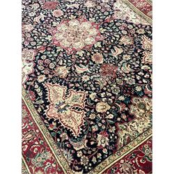 Persian Tabriz rug, blue ground field decorated all-over with trailing branch an floral motifs, repeating scroll border with guards