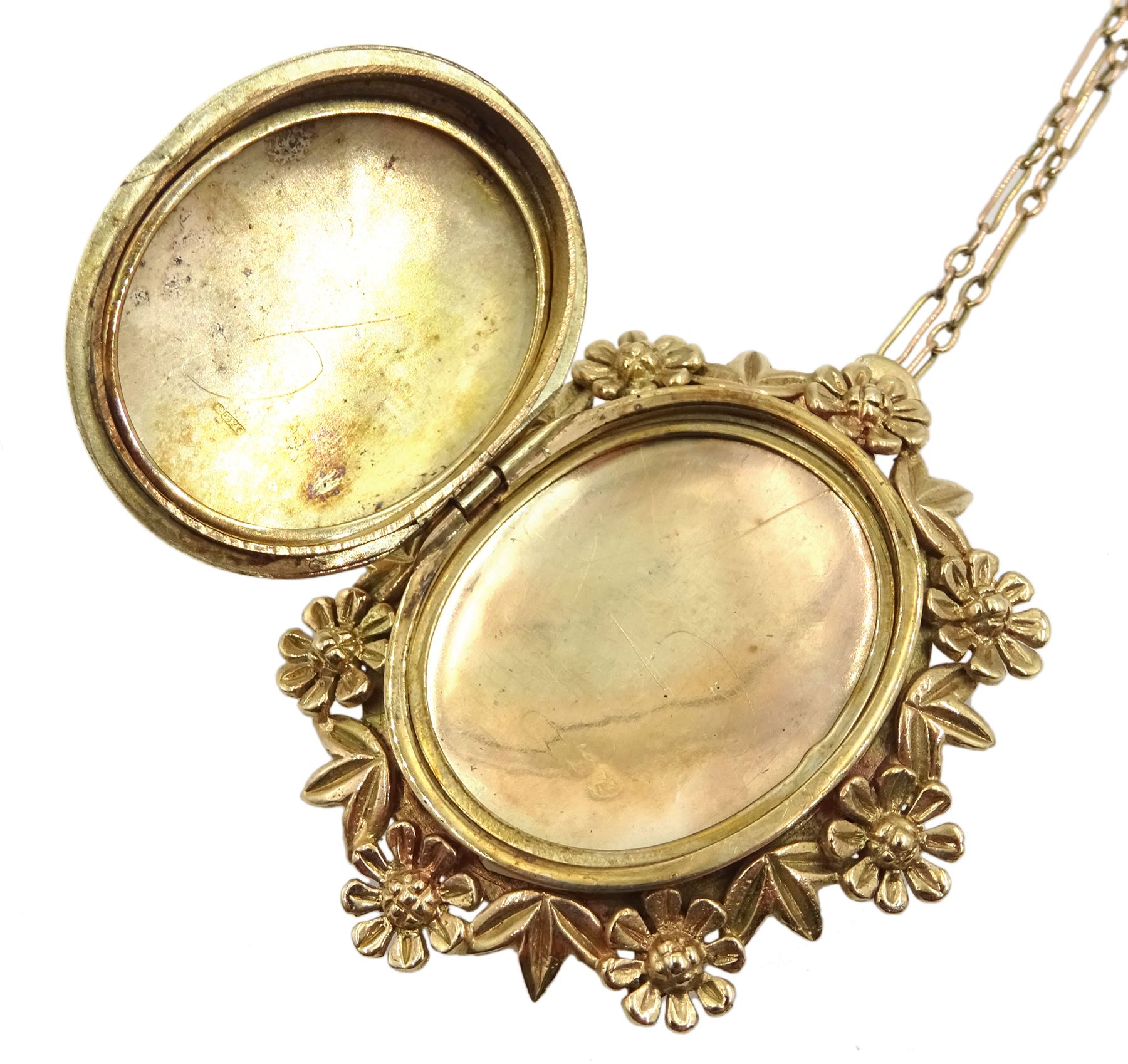 Gold hinged locket pendant/brooch, with foliate border, hallmarked, on 9ct gold link chain necklace