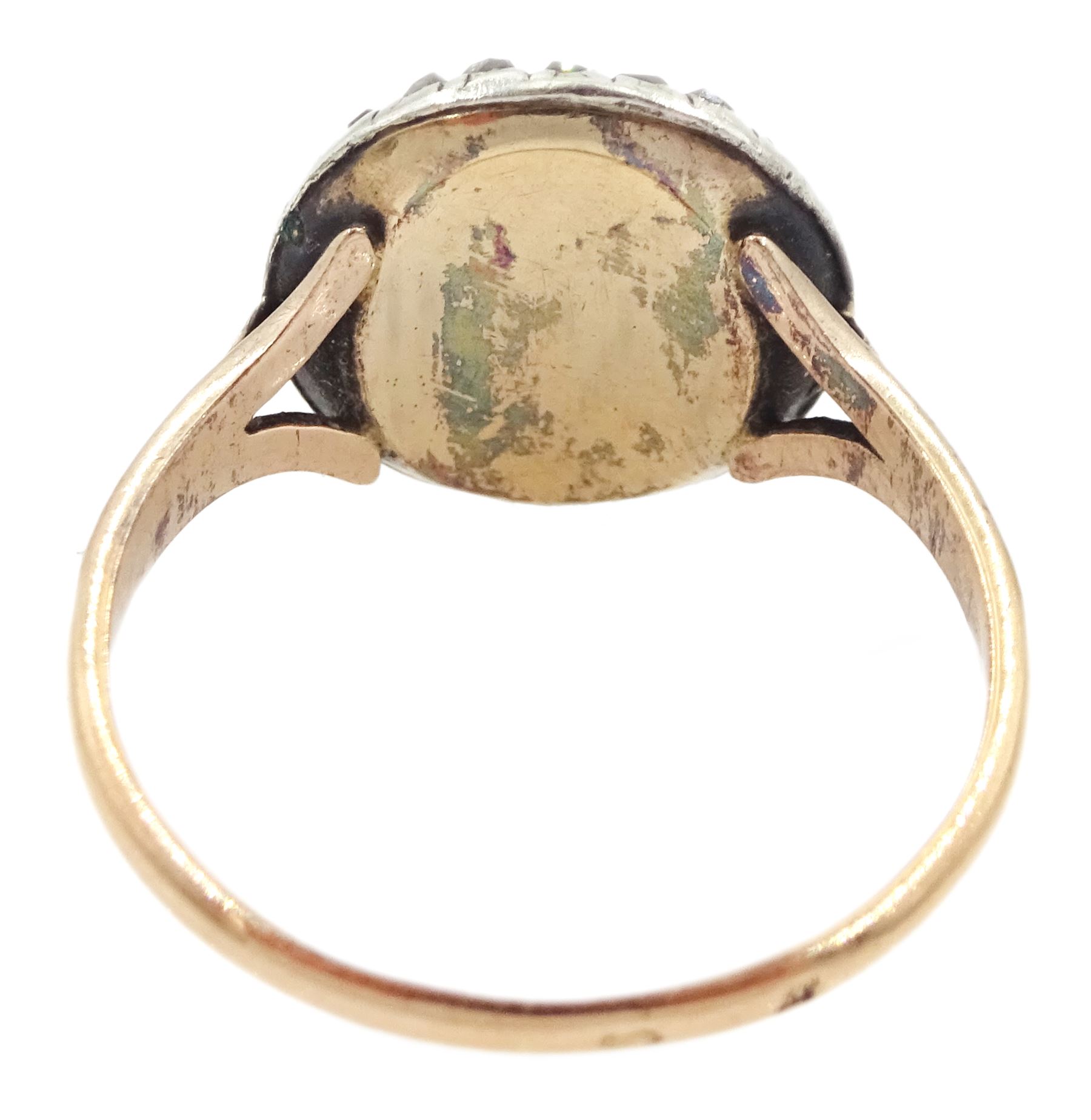 19th century French 18ct gold and silver diamond portrait ring, set with an oval miniature of a woman in 18th century dress on ivory, under a glazed panel, with rose cut diamond surround and trifurcated shoulders, hallmarked. This lot has been registered for sale under Section 10 of the APHA Ivory Act