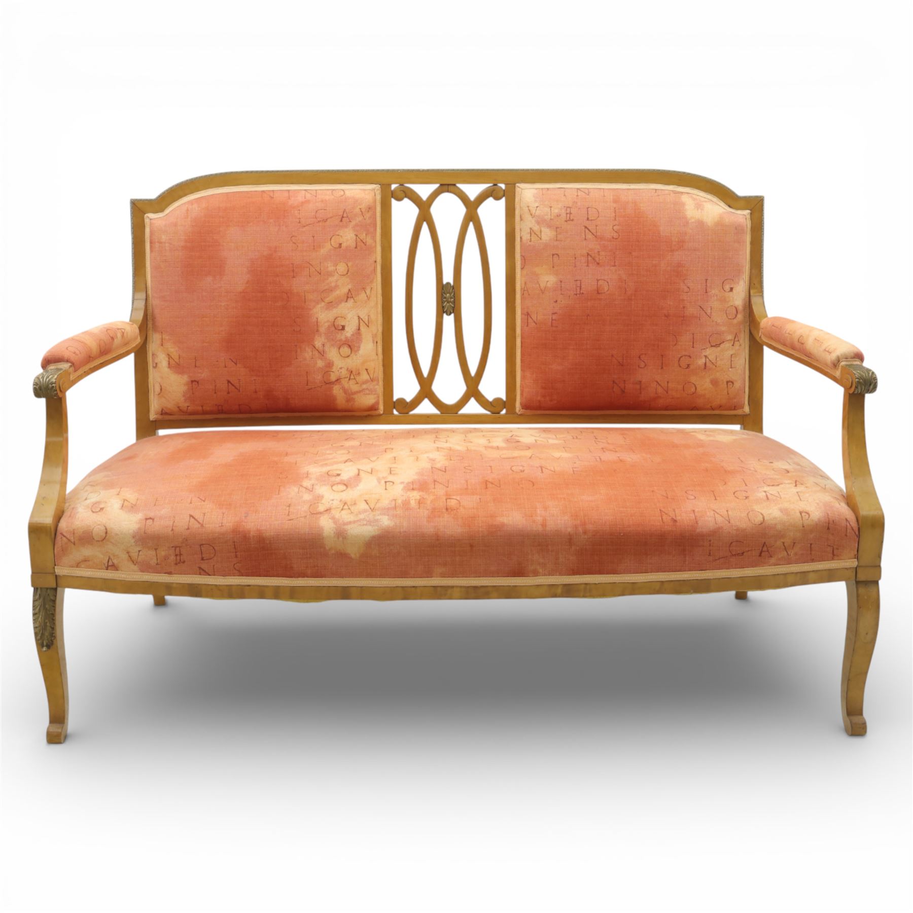 Edwardian satinwood settee, the shaped and bowed top rail enclosing a pierced splat with interlaced oval slats, flanked by upholstered back panels, the padded arms with scrolling terminals, the upholstered seat raised on cabriole supports with pad feet