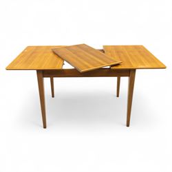 Gordon Russell - mid 20th century teak dining suite, comprising rectangular extending dining table and six matching chairs including one carver, each chair with padded upholstered seat and backrest in vinyl, on square supports, the table with plain top and rounded edges on tapered legs, an example of the firm’s functional post-war design with restrained modernist detailing (Chairs H 85cm, W 47cm, D 46cm) (Extends to 154cm)