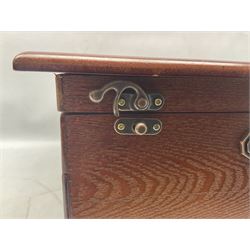 Waltmann und Sohn part canteen of stainless steel and gilt cutlery, the stained wood case with hinged lid above two fitted drawers, L48cm