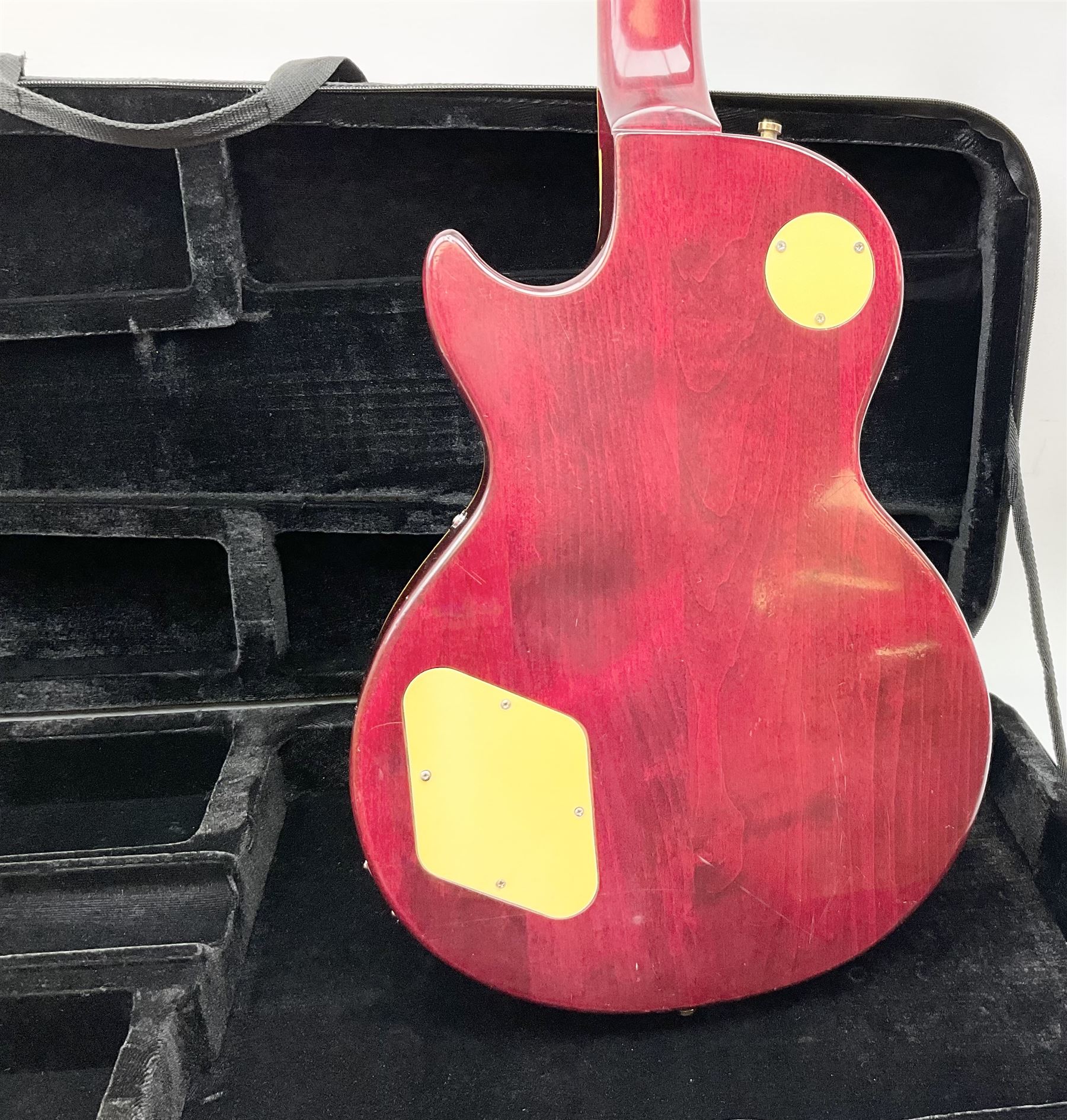 1980s Les Paul Epiphone limited edition cut-away electric guitar by Gibson, the burgundy coloured body with two pick-ups, volume and tone knobs and scratch plate, original tuning pegs, serial no.U6030215, 101cm overall; in modern Kinsman fitted carrying case