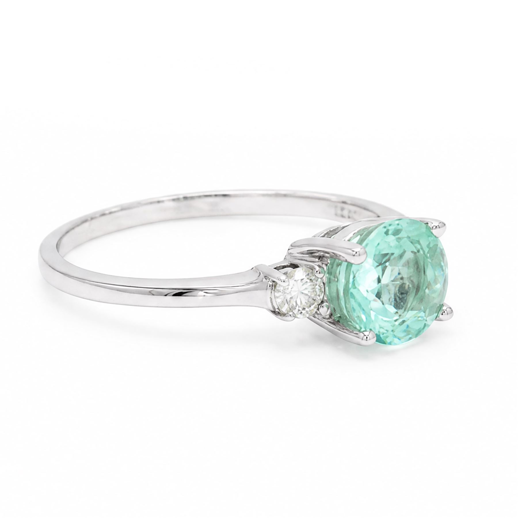 18ct white gold Paraiba tourmaline and diamond three stone ring, single round cut tourmaline of approx 1.50 carat, with a single round brilliant cut diamond set either side, hallmarked, total diamond weight approx 0.15 carat