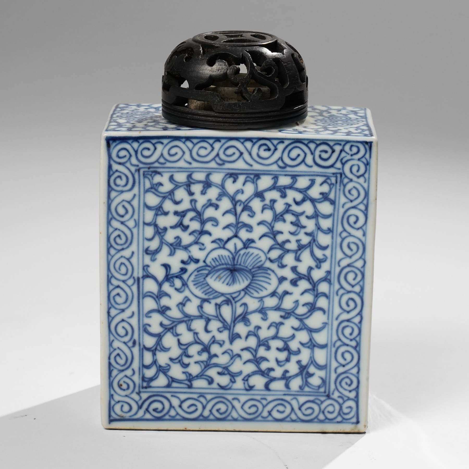 Two Chinese blue and white tea caddys, and another with famille rose design and engraved metal lid, larger H16cm (3)