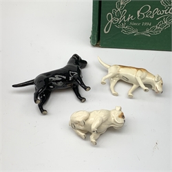 Three Beswick dog figurines, comprising Bulldog, Black Labrador, and Hound, Labrador with maker's box, each with printed mark beneath.