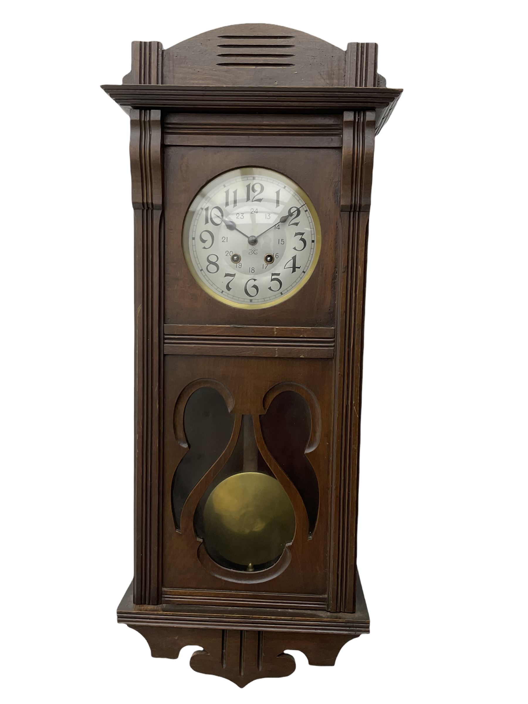 An early 20th century Art nouveau style wall clock with a French
