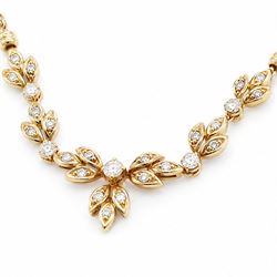 18ct gold diamond floral design necklace, five round brilliant cut diamonds, each spaced by leaf design links set with diamonds, to a Spiga link chain, Sheffield import mark 1989, total diamond weight approx 0.75 carat