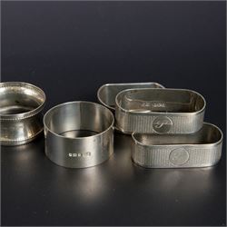 Five silver napkin rings, including pair of 1930s oval examples, with engine turned decoration with engraved initial, together with a collection of silver flatware, including Norwegian spoon, pair of Fiddle pattern mustard spoons, five seal top coffee spoons, etc, all stamped or hallmarked