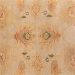 West Persian hand-knotted Ziegler design rug, ivory field decorated with an all-over lattice of stylized palmettes and floral sprays linked by angular vines, border of scrolling floral ornamentation in a palette of blush pink, sage green, powder blue, and soft ochre, with cotton fringe ends 