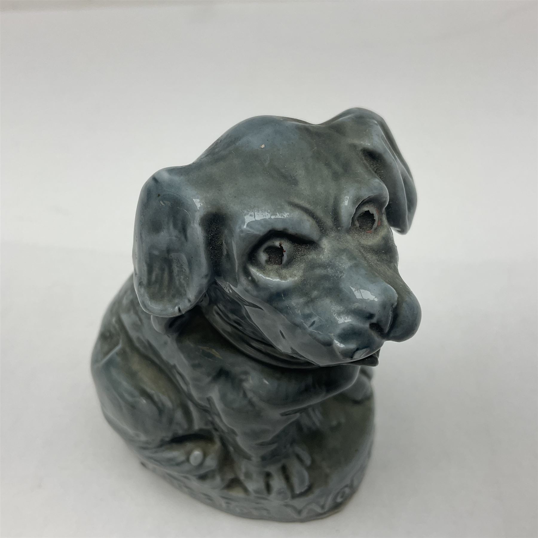 Suffragette blue glazed moulded ceramic dog, inscribed Votes For Women, H9cm