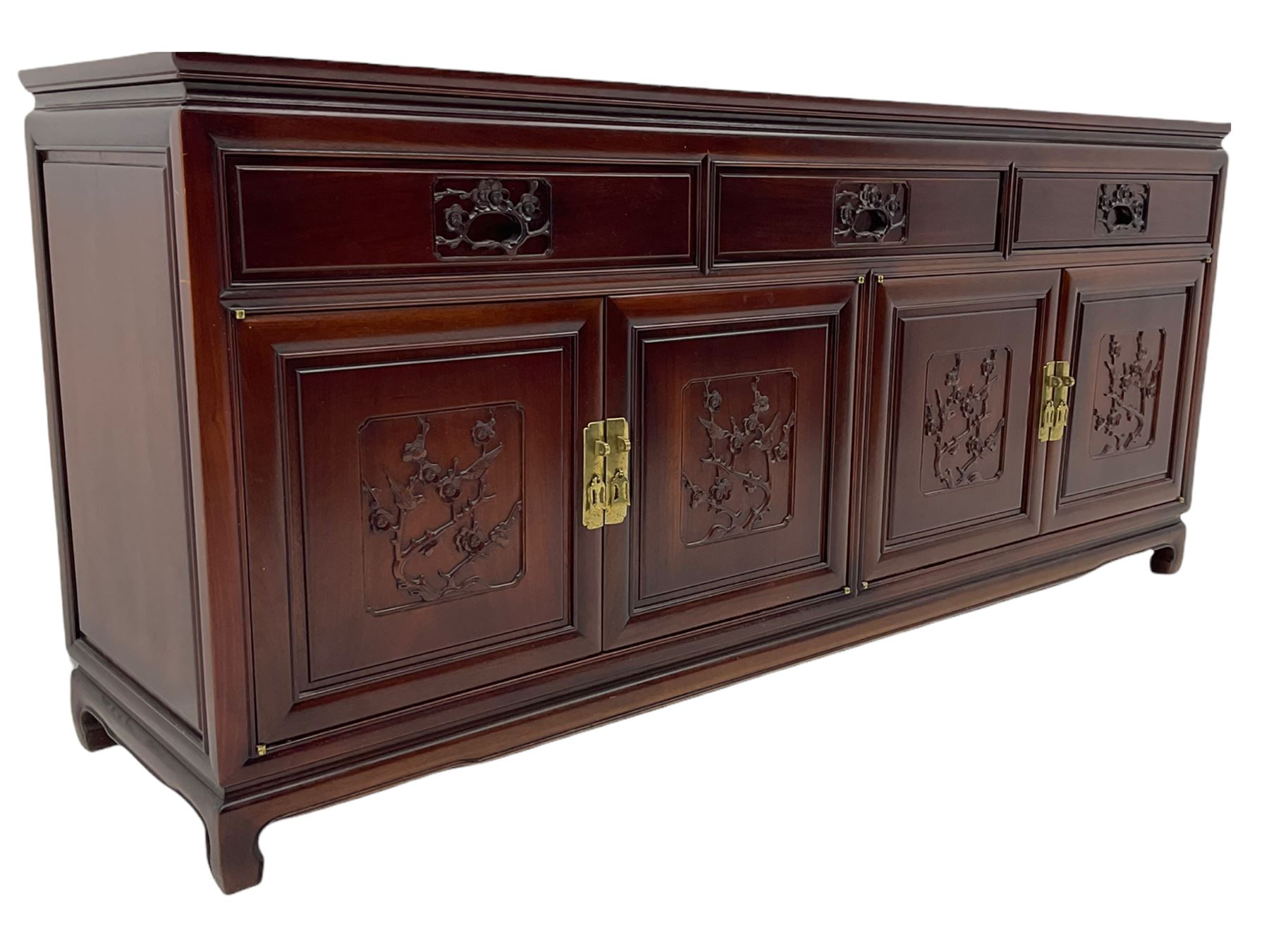 Chinese hardwood sideboard, three drawers above four cupboards, the doors relief carved with flowers and birds 