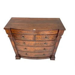 Late 19th century bow-front chest, fitted with two short and three long drawers, the figured drawer fronts cockbeaded and flanked by column uprights, on castors