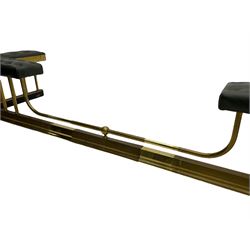 Victorian design brass telescopic extending club fire fender, the corner seats upholstered in buttoned green fabric over plain balustrade, on moulded base with floral cast corner brackets 