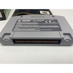 Nintendo 64 console, two controllers, games and accessories. Accessories to include the ‘Tremorpak’ and ‘Spook’ 2 Phono plugs and a S-VHS plug with adapter, both in original boxes. Games to include ‘Golden Eye 007’, ‘Doom 64’, ‘Killer Instinct Gold’, ‘Tetrisphere’, ‘F-1 World Grand Prix’, ‘Pilotwings 64’ and ‘Lylatwars’ with ‘Rumble Pak’, all with original boxes and instruction manuals. ‘Star Wars Episode I Racer’ game cartridge in Shadows of the Empire box. 