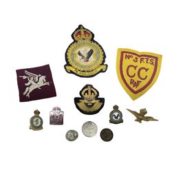 Quantity of RAF and other fabric and metal badges, plus three coins