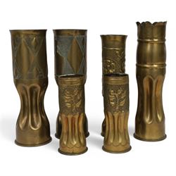 Pair of Second World War Trench Art M14 Shell Cases, each relief-decorated and engraved with a portrait of General de Gaulle, together with another pair decorated with lions and two others, largest H36cm 