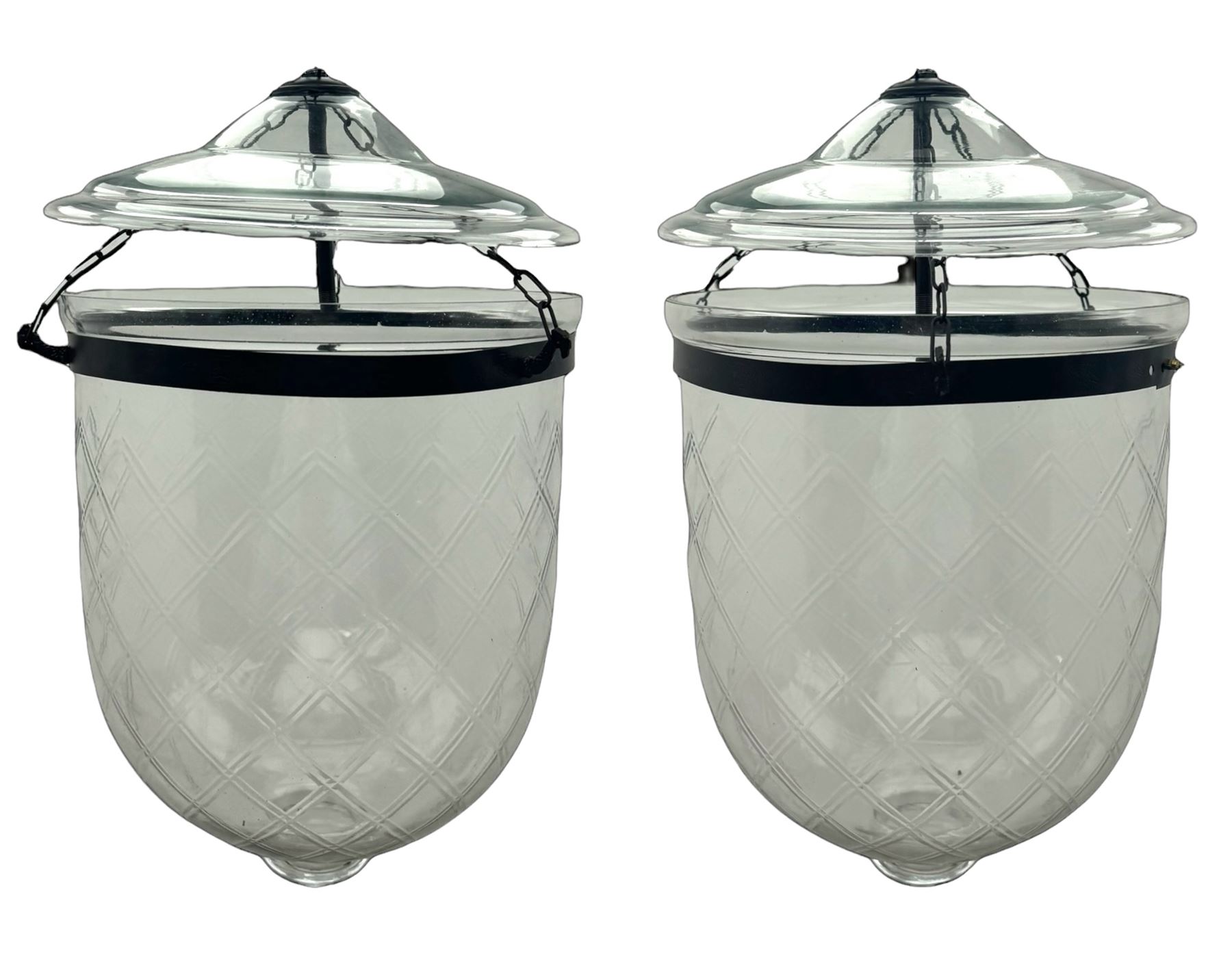 India Jane Interiors - pair of glass hanging lanterns, diamond cut glass bell jars topped with a wide glass dish and suspended by three brass chains, black metal hooks with a dragon head motif attach the chains to the rim