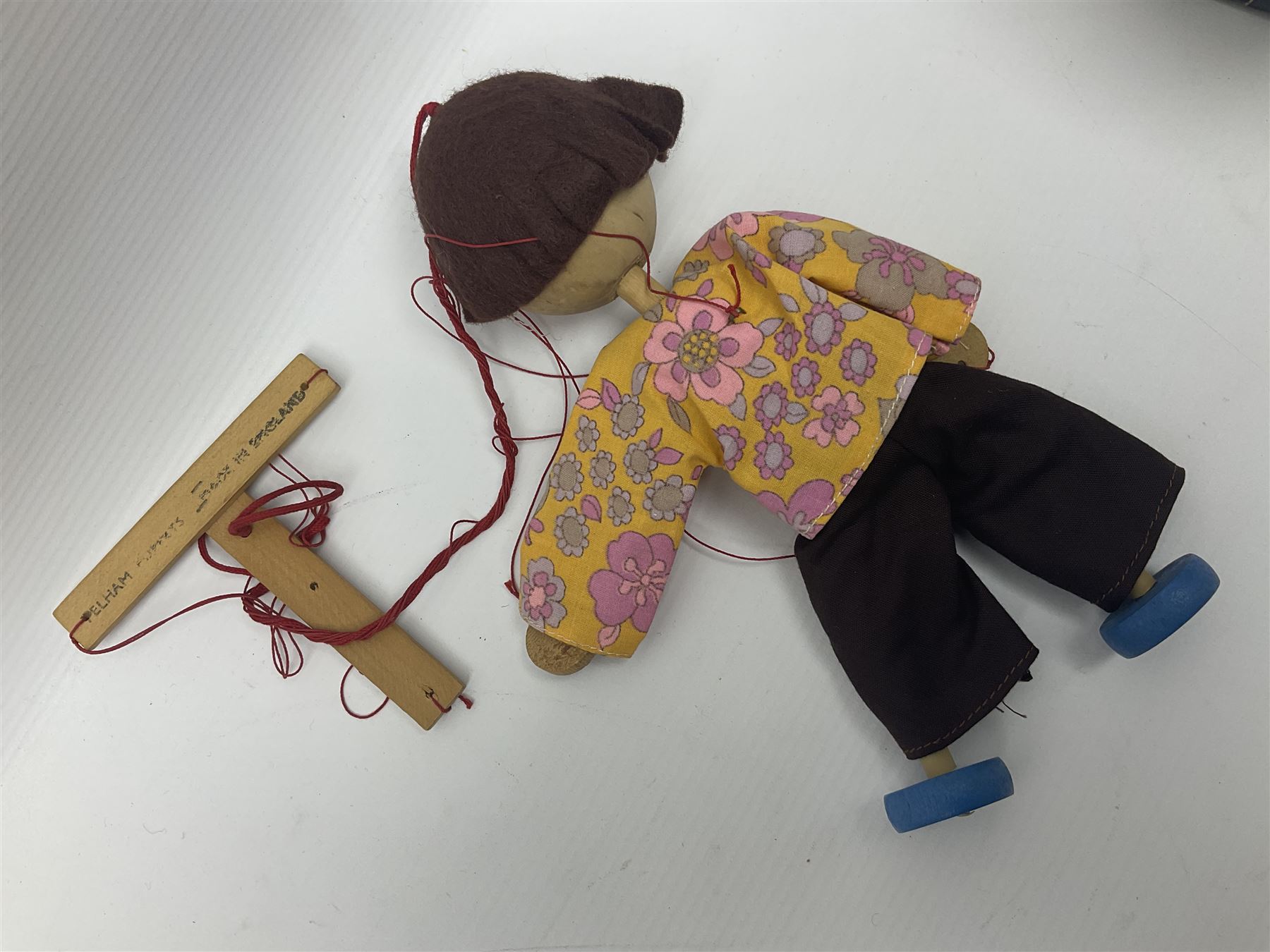 Pelham Puppet - three puppets comprising a painted wooden duck with felt mouth and wings with metal joints H12cm, in original box and instructions; and two further examples Type A cat with a hollow body H12cm, and a boy H23cm (3) 