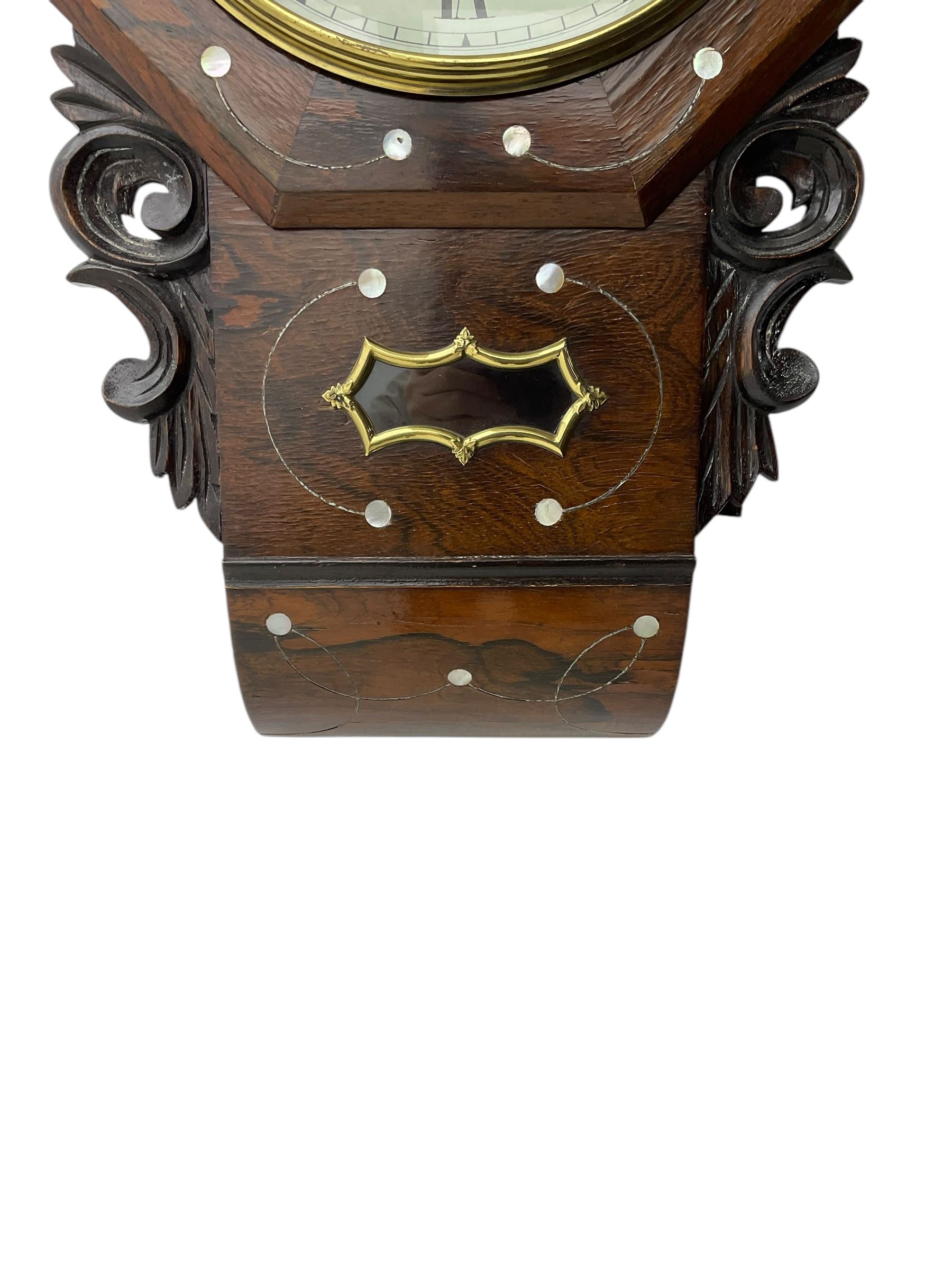 George Pickering of Hull - 8-day American mahogany and mother of pearl inlaid drop dial wall clock c 1880, with an octagonal dial surround and spun brass bezel, painted dial with Roman numerals, minute track, retailers name and Maltese cross hands, case with an ogee base, carved ears and pendulum viewing glass, twin train spring driven movement striking the hours on a bell.  With key and pendulum.