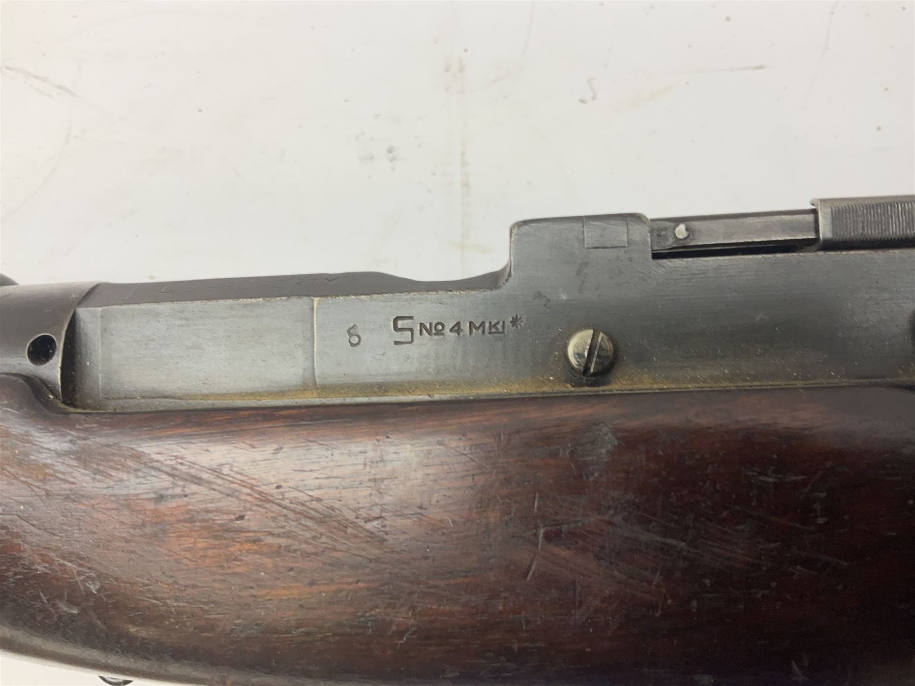 Lee Enfield SMLE .303 No.4 Mk.1* bolt action rifle with 63.5cm barrel and original webbing sling; lacking magazine; No.75C8419; L111cm overall; deactivated to early specification so requires re-deactivation to modern standards SECTION 1 RFD ONLY