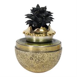 Late 20th century silver and silver-gilt surprise egg, the textured gilt exterior opening to reveal a clutch of chicks, the clustered heads supported upon a spring, within a jagged and lobed silver and gilt encasement, with green enamel surround, hallmarked Stuart Devlin, London 1982, H7cm