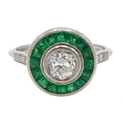  Platinum old cut diamond and calibre cut emerald target ring, with diamond set shoulders, central diamond approx 0.65 carat  [image code: 1mc]  