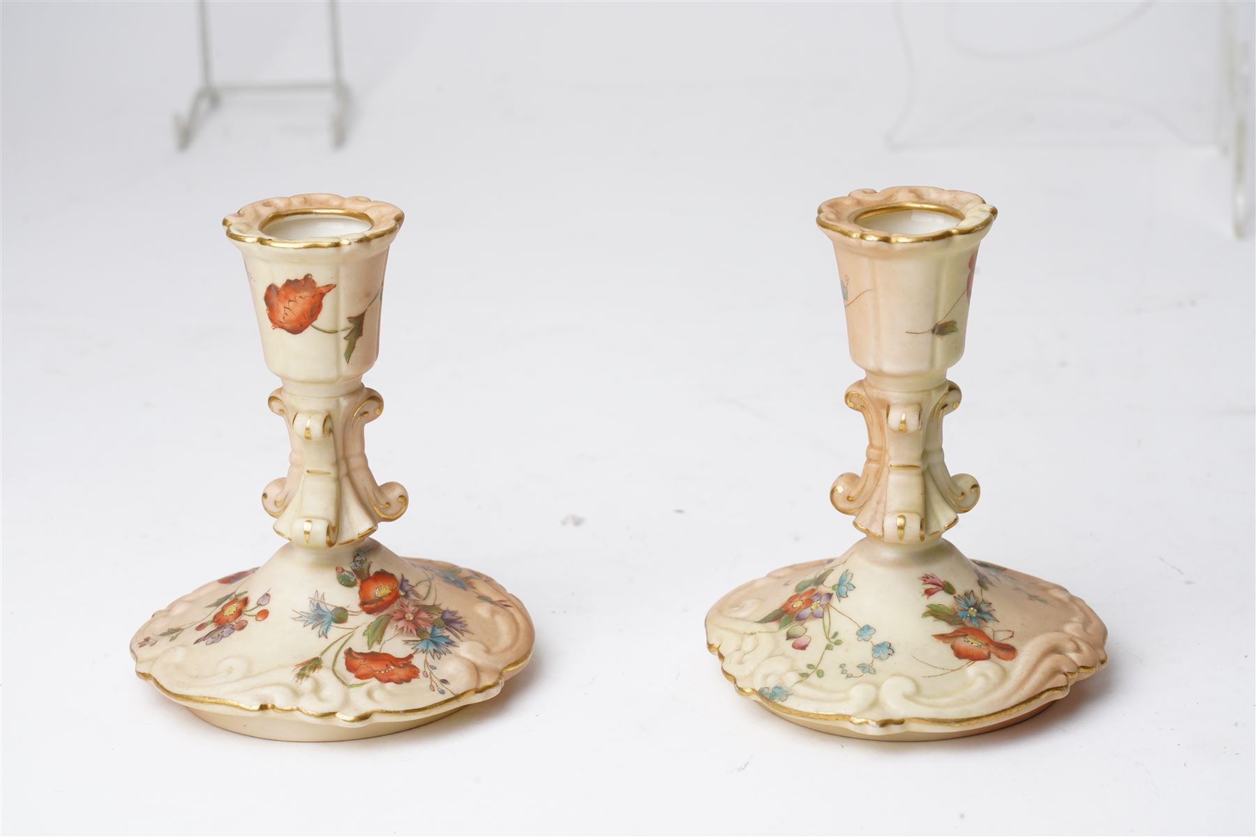Collection of Worcester blush ivory, including a pot pourri and a pair of candlesticks by George Grainger & Co, with brown and green stamps to bases, together with a teacup and saucer with marks in puce, candlesticks H12cm 