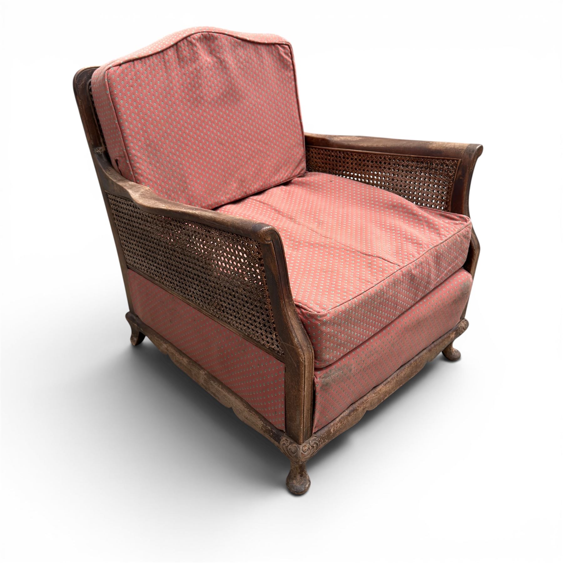 Early 20th century French style bergère conservatory suite, canework back and sides with red upholstered loose seat cushions, on cabriole feet