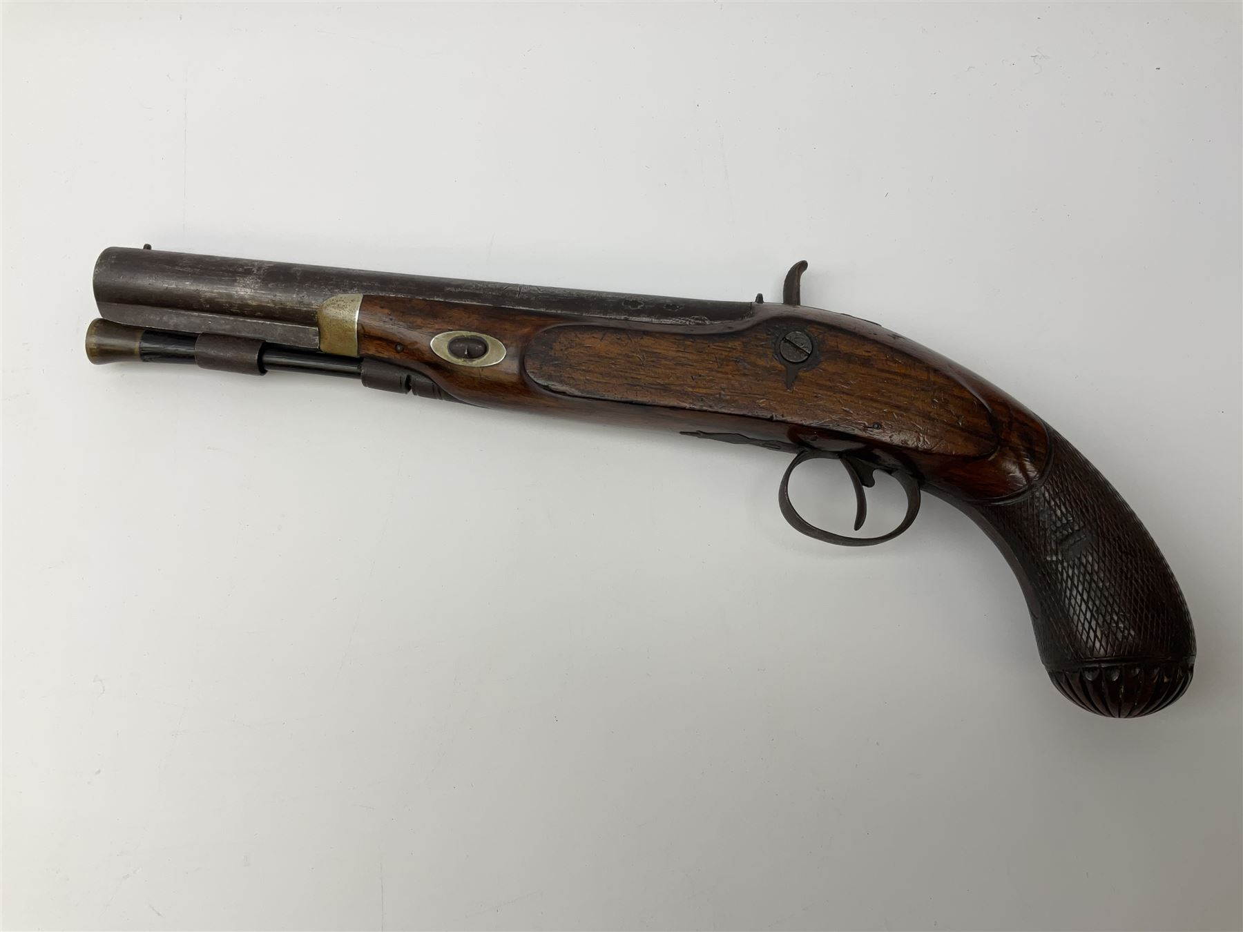 19th century flintlock converted to percussion cap target pistol, the 20.5cm barrel engraved with a sunburst motif to the top and ramrod under, foliate engraved lock-plate and trigger guard, silver plated fittings, walnut stock with chequered grip and melon fluted butt L35.5cm overall