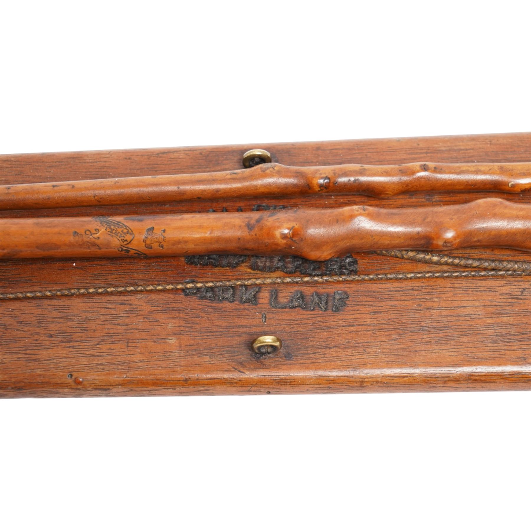 Callow & Son - 19th century travelling coaching whip, the two part yew wood shaft, with silver collars and butt end, hallmarked U & T Walker, London, with leather handle, upon a Callow & Son mount, whip L166cm 