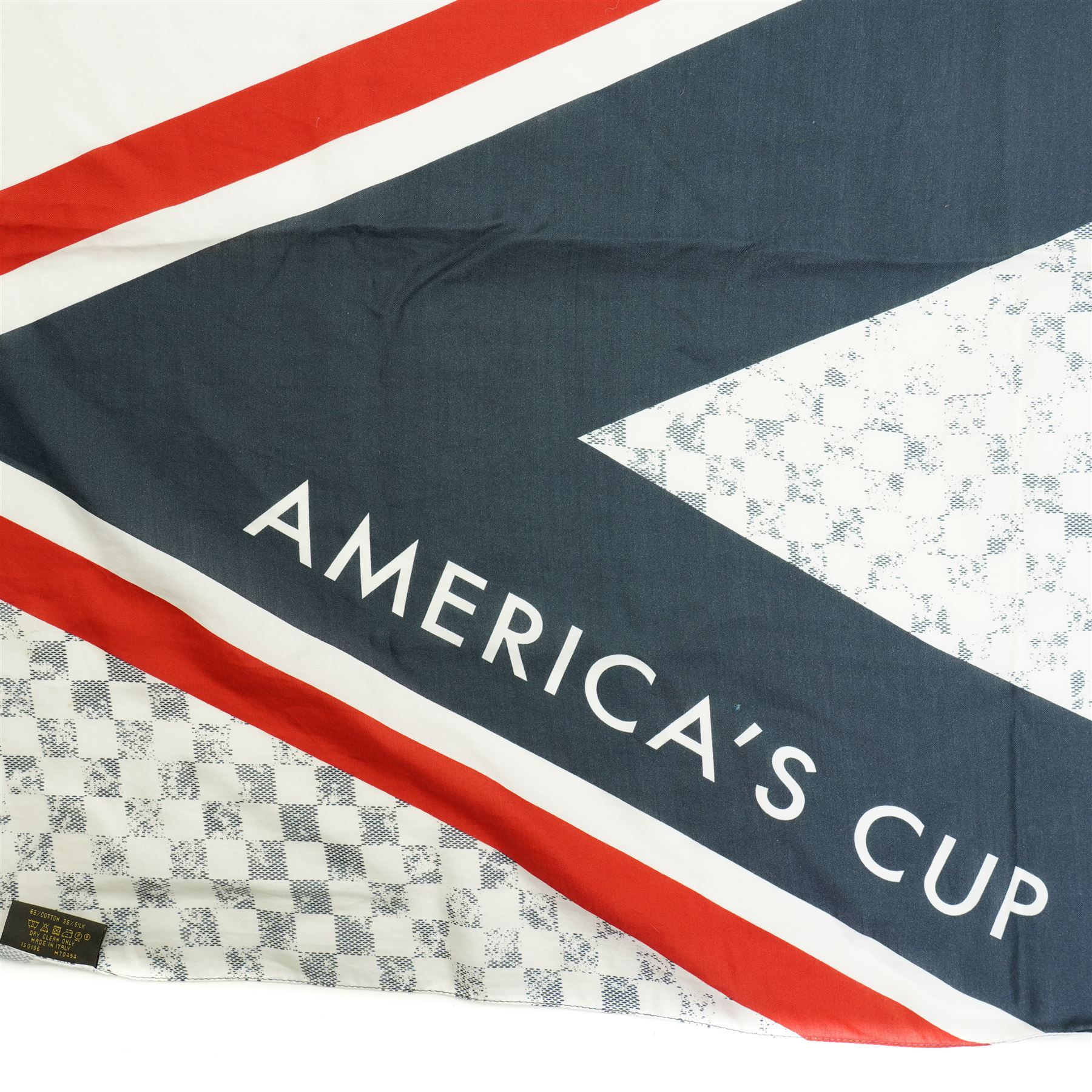 Louis Vuitton America’s Cup stole, the Damier-pattern ground with navy, red and white graphic panels, large ‘35’ motif and Louis Vuitton and America’s Cup lettering, fringed ends, label stamped Louis Vuitton Paris, 65% cotton and 35% silk, made in Italy, 201cm x 66cm